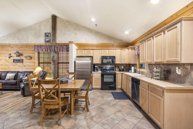 135 Rock Candy Ln, Branson, MO 65616 - kitchen featuring light countertops, black appliances, light brown cabinetry, and decorative backsplash