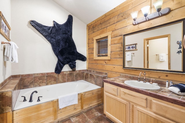135 Rock Candy Ln, Branson, MO 65616 - full bath featuring a garden tub, wood walls, and vanity