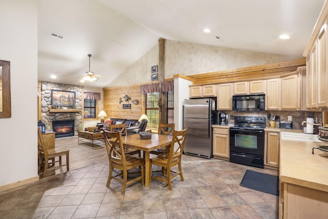 135 Rock Candy Ln, Branson, MO 65616 - kitchen featuring light brown cabinets, light countertops, black appliances, visible vents, and a sink