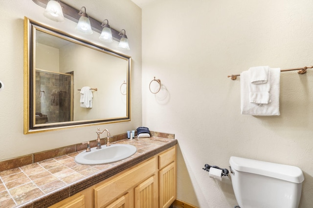 135 Rock Candy Ln, Branson, MO 65616 - full bathroom with toilet, a shower stall, and vanity