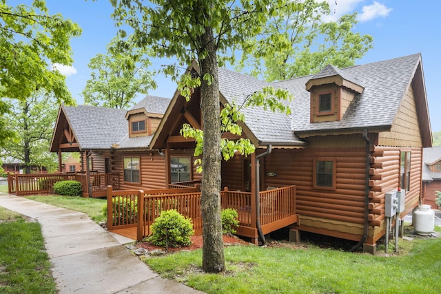 135 Rock Candy Ln, Branson, MO 65616 - cabin featuring a front yard, roof with shingles, a wooden deck, and log exterior