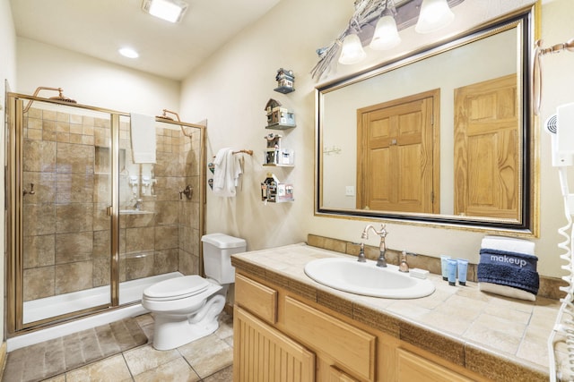 135 Rock Candy Ln, Branson, MO 65616 - bathroom with toilet, a stall shower, vanity, and tile patterned flooring