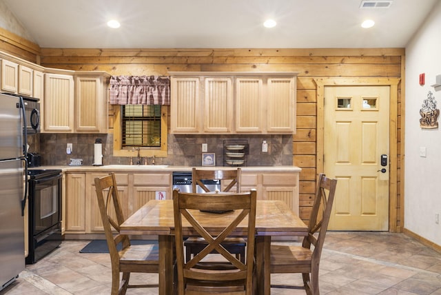 135 Rock Candy Ln, Branson, MO 65616 - kitchen featuring backsplash, light countertops, light brown cabinetry, and stainless steel appliances