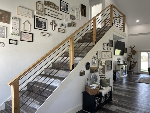 3826 S 77th Rd, Dunnegan, MO 65640 - stairs with wood finished floors, a high ceiling, and recessed lighting