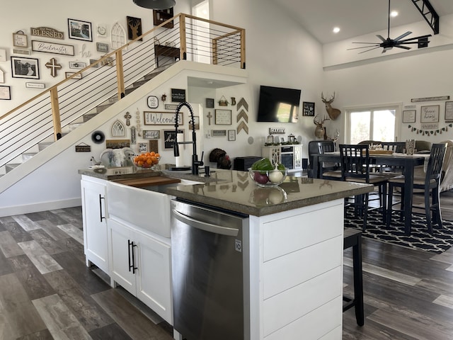 3826 S 77th Rd, Dunnegan, MO 65640 - kitchen with ceiling fan, stainless steel dishwasher, dark wood finished floors, dark countertops, and open floor plan