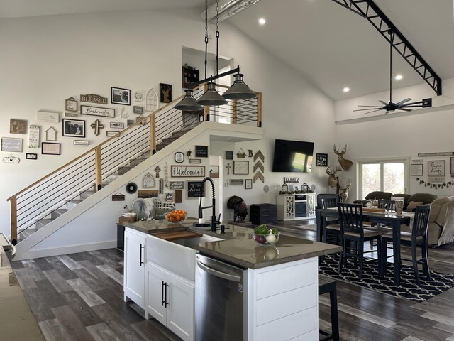 3826 S 77th Rd, Dunnegan, MO 65640 - kitchen with high vaulted ceiling, stainless steel dishwasher, dark wood finished floors, dark countertops, and open floor plan