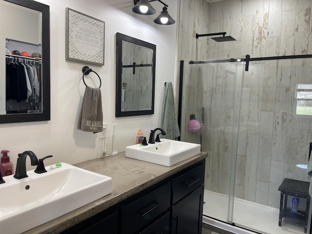 3826 S 77th Rd, Dunnegan, MO 65640 - full bathroom featuring a sink, a spacious closet, double vanity, and a stall shower