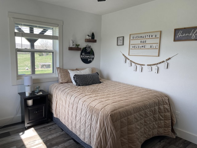3826 S 77th Rd, Dunnegan, MO 65640 - bedroom featuring baseboards and wood finished floors