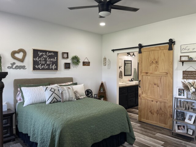 3826 S 77th Rd, Dunnegan, MO 65640 - bedroom with a barn door, ceiling fan, dark wood finished floors, recessed lighting, and connected bathroom