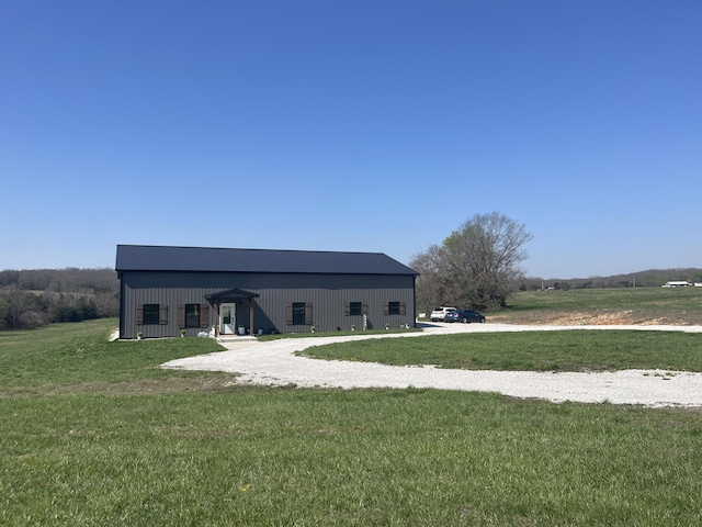 3826 S 77th Rd, Dunnegan, MO 65640 - rear view of property featuring an outbuilding, an outdoor structure, and a lawn