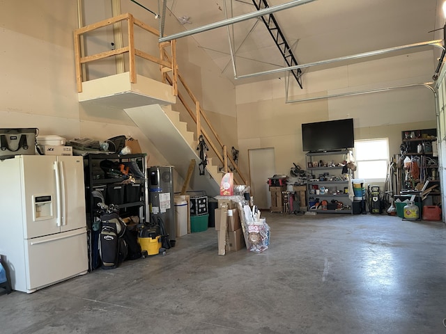 3826 S 77th Rd, Dunnegan, MO 65640 - garage featuring white refrigerator with ice dispenser