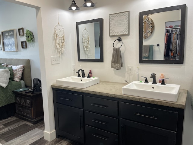 3826 S 77th Rd, Dunnegan, MO 65640 - full bath with wood finished floors, double vanity, and a sink
