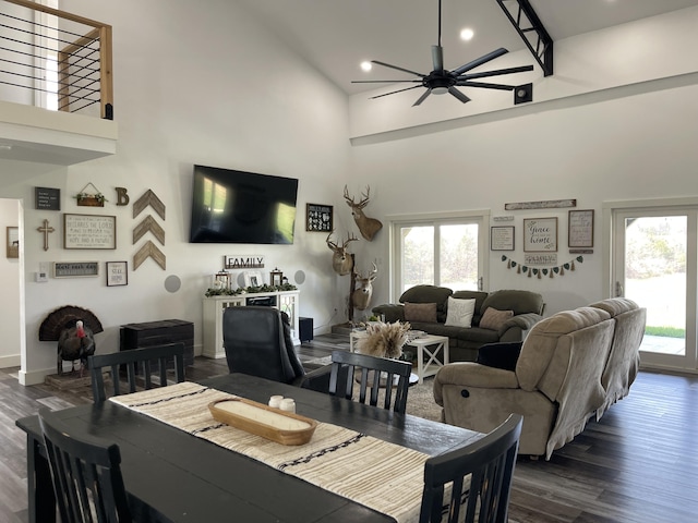 3826 S 77th Rd, Dunnegan, MO 65640 - dining space with baseboards, dark wood-style flooring, ceiling fan, recessed lighting, and a towering ceiling