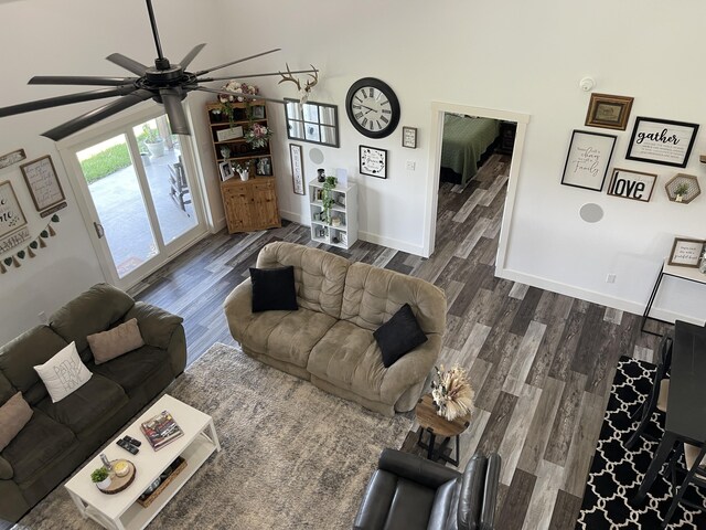 3826 S 77th Rd, Dunnegan, MO 65640 - living area featuring wood finished floors, baseboards, and a ceiling fan