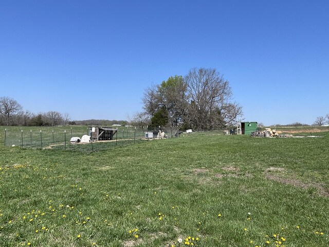 3826 S 77th Rd, Dunnegan, MO 65640 - view of yard with a rural view, fence, and an outdoor structure