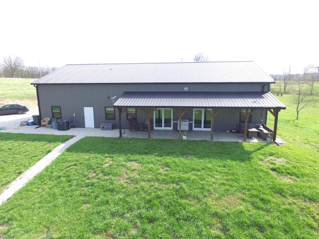 3826 S 77th Rd, Dunnegan, MO 65640 - rear view of property with a patio area, cooling unit, and a lawn
