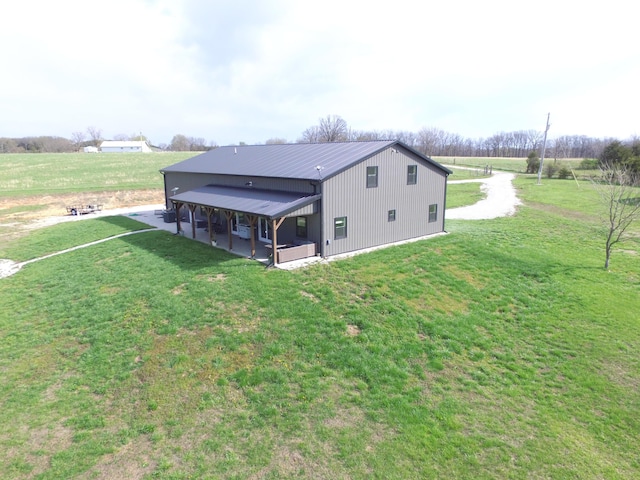3826 S 77th Rd, Dunnegan, MO 65640 - rear view of property featuring a yard and metal roof