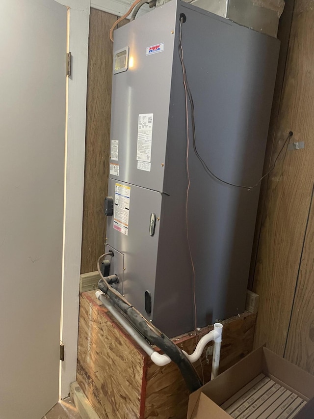 utility room featuring heating unit