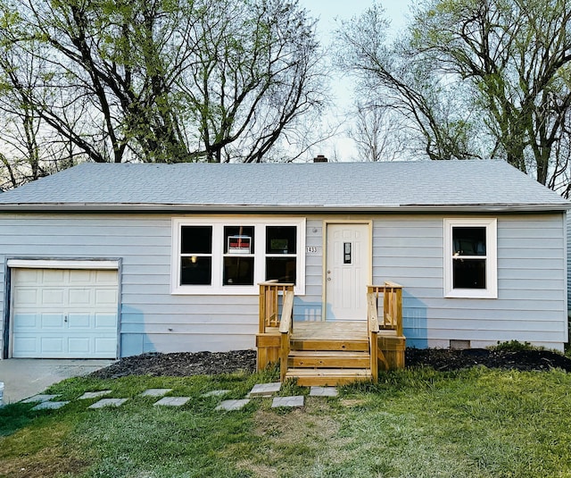 ranch-style home with a front yard, an attached garage, and crawl space