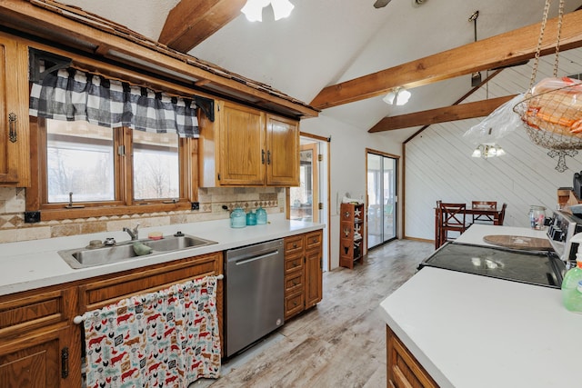 kitchen with vaulted ceiling with beams, light countertops, backsplash, dishwasher, and a sink