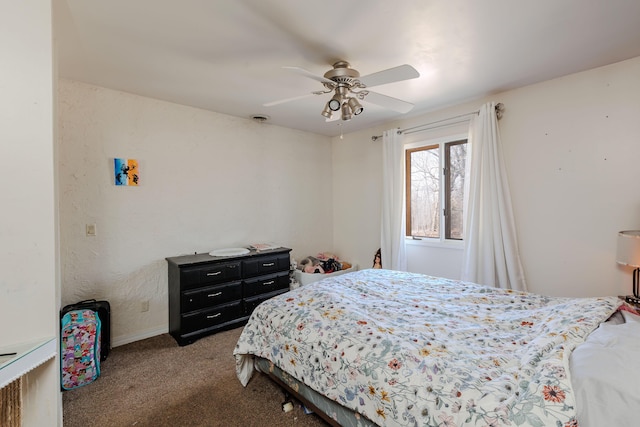 bedroom with visible vents, baseboards, a ceiling fan, and carpet