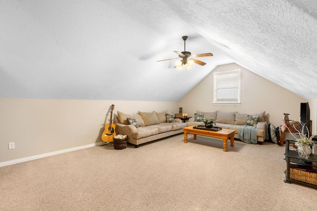 living room with baseboards, vaulted ceiling, a textured ceiling, a ceiling fan, and carpet floors