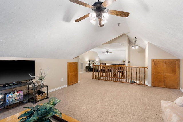 bonus room with baseboards, ceiling fan, carpet, a textured ceiling, and lofted ceiling