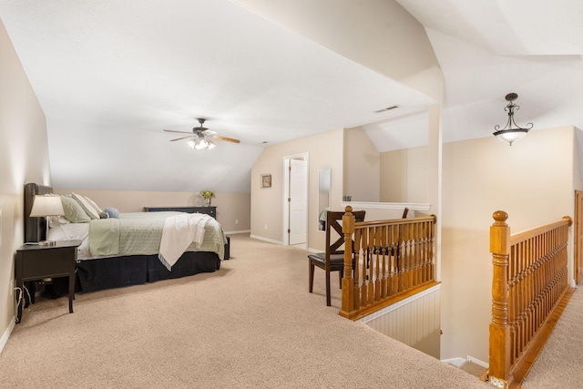 bedroom with ceiling fan, visible vents, light carpet, lofted ceiling, and baseboards