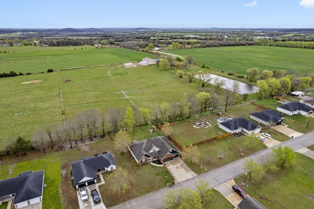 aerial view featuring a rural view and a water view