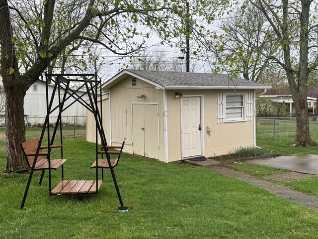 view of outbuilding with an outbuilding and fence