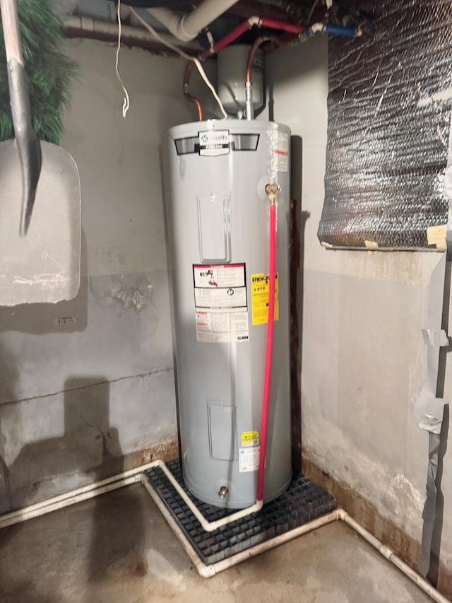 utility room featuring electric water heater