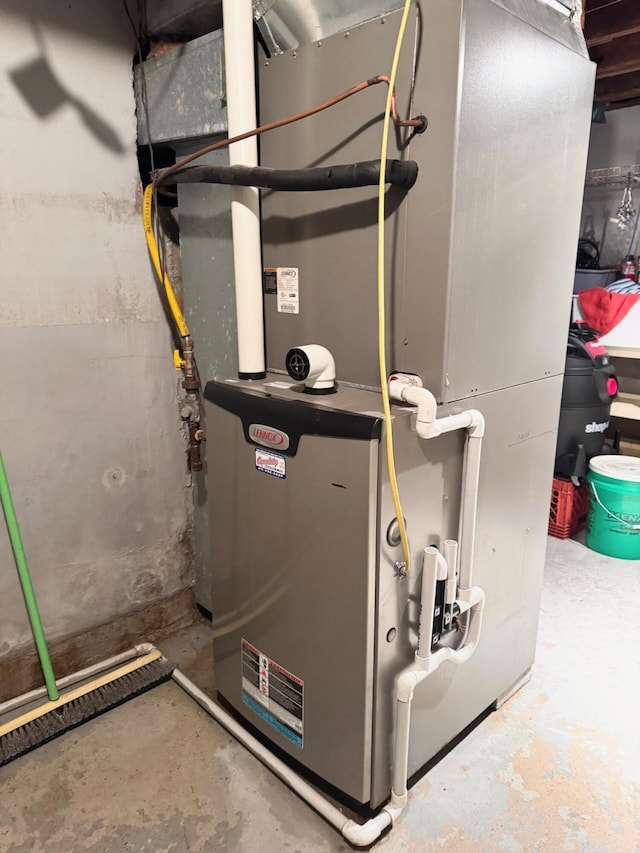 utility room with heating unit