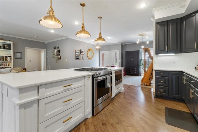 2111 Sycamore Dr, West Plains, MO 65775 - kitchen featuring high end range, light countertops, ornamental molding, and decorative backsplash
