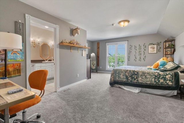 2111 Sycamore Dr, West Plains, MO 65775 - bedroom featuring light colored carpet, ensuite bath, vaulted ceiling, visible vents, and baseboards