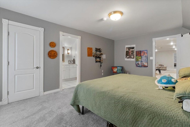2111 Sycamore Dr, West Plains, MO 65775 - bedroom featuring light carpet, ensuite bath, and baseboards