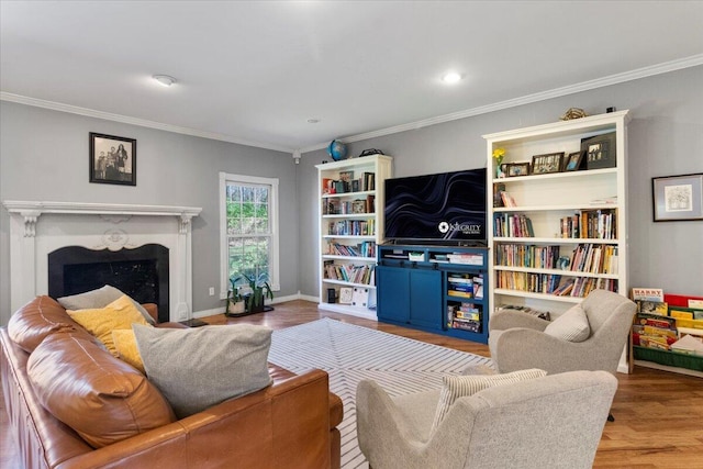 2111 Sycamore Dr, West Plains, MO 65775 - living area with a fireplace, baseboards, ornamental molding, and wood finished floors