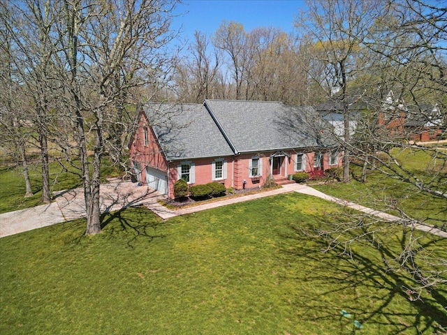 2111 Sycamore Dr, West Plains, MO 65775 - view of front of home featuring concrete driveway, a front yard, brick siding, and an attached garage