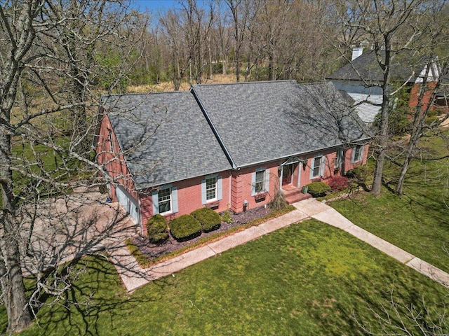 2111 Sycamore Dr, West Plains, MO 65775 - view of front facade with concrete driveway, roof with shingles, and a front lawn