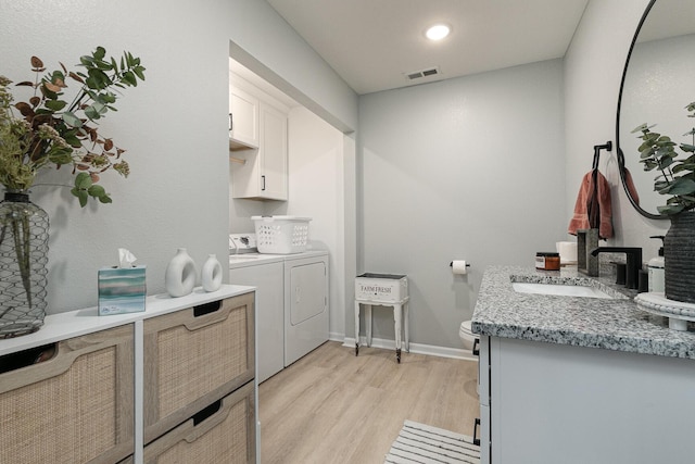 1798 E 328th Rd, Bolivar, MO 65613 - laundry area featuring light wood-style floors, a sink, washer and dryer, baseboards, and cabinet space