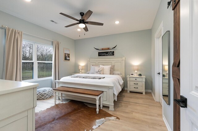 1798 E 328th Rd, Bolivar, MO 65613 - bedroom with baseboards, recessed lighting, light wood-style flooring, a ceiling fan, and visible vents