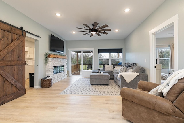 1798 E 328th Rd, Bolivar, MO 65613 - living room featuring recessed lighting, a barn door, light wood-style flooring, and a ceiling fan