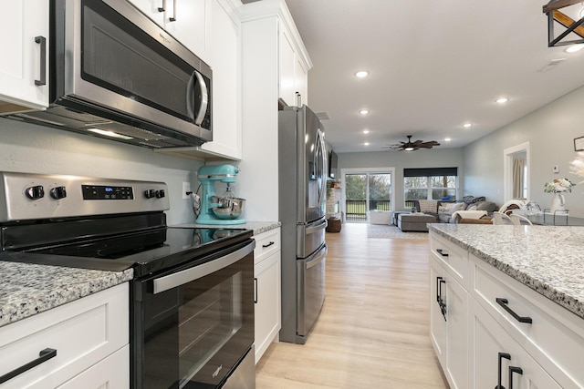 1798 E 328th Rd, Bolivar, MO 65613 - kitchen with appliances with stainless steel finishes, a ceiling fan, white cabinetry, recessed lighting, and light wood-style flooring