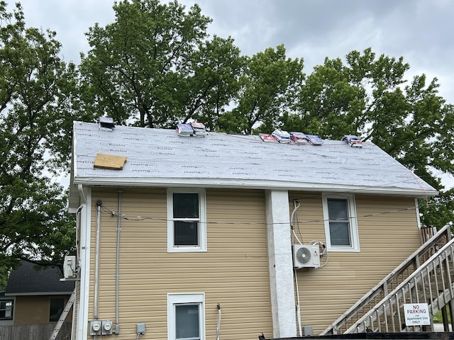 219 E State St, Mountain Grove, MO 65711 - back of property featuring a cooling unit and stairway