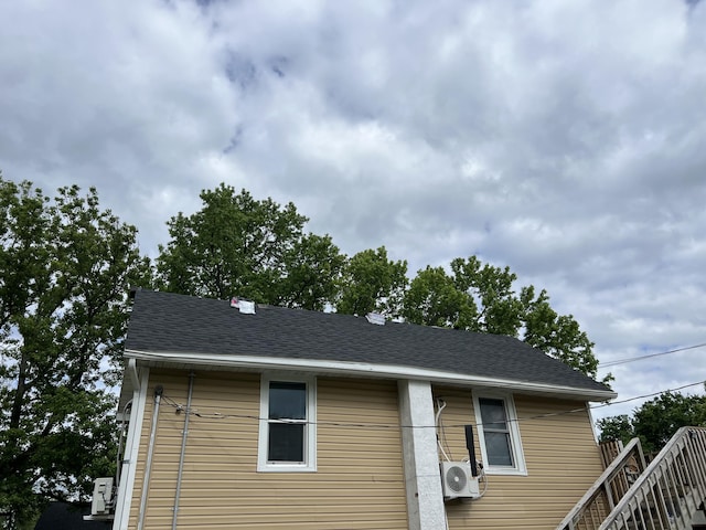 219 E State St, Mountain Grove, MO 65711 - view of front of house with a cooling unit and roof with shingles