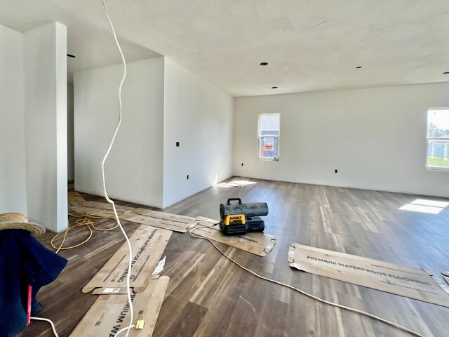 710 E Vivian St, Bolivar, MO 65613 - unfurnished living room with wood finished floors and a healthy amount of sunlight
