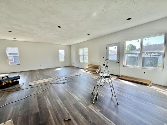 710 E Vivian St, Bolivar, MO 65613 - interior space with a textured ceiling and wood finished floors
