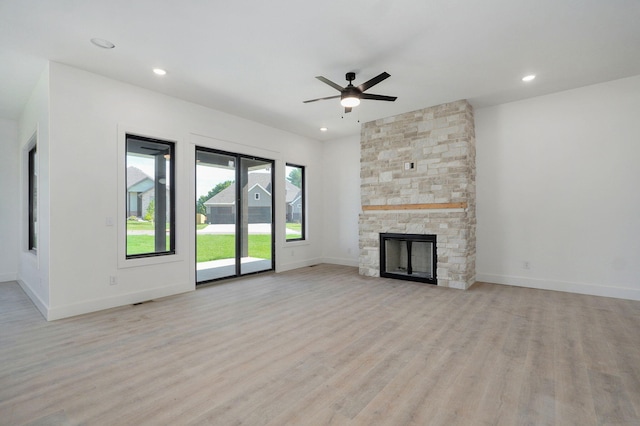 3021 W Allen Dr, Springfield, MO 65810 - unfurnished living room with light wood-style floors, ceiling fan, a fireplace, and recessed lighting