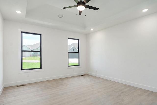 3021 W Allen Dr, Springfield, MO 65810 - unfurnished room with plenty of natural light, light wood-style floors, recessed lighting, and a tray ceiling