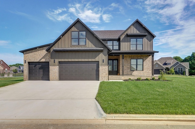 3021 W Allen Dr, Springfield, MO 65810 - view of front of house featuring a front yard, concrete driveway, brick siding, and board and batten siding