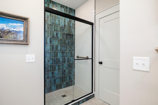 full bath with a shower stall